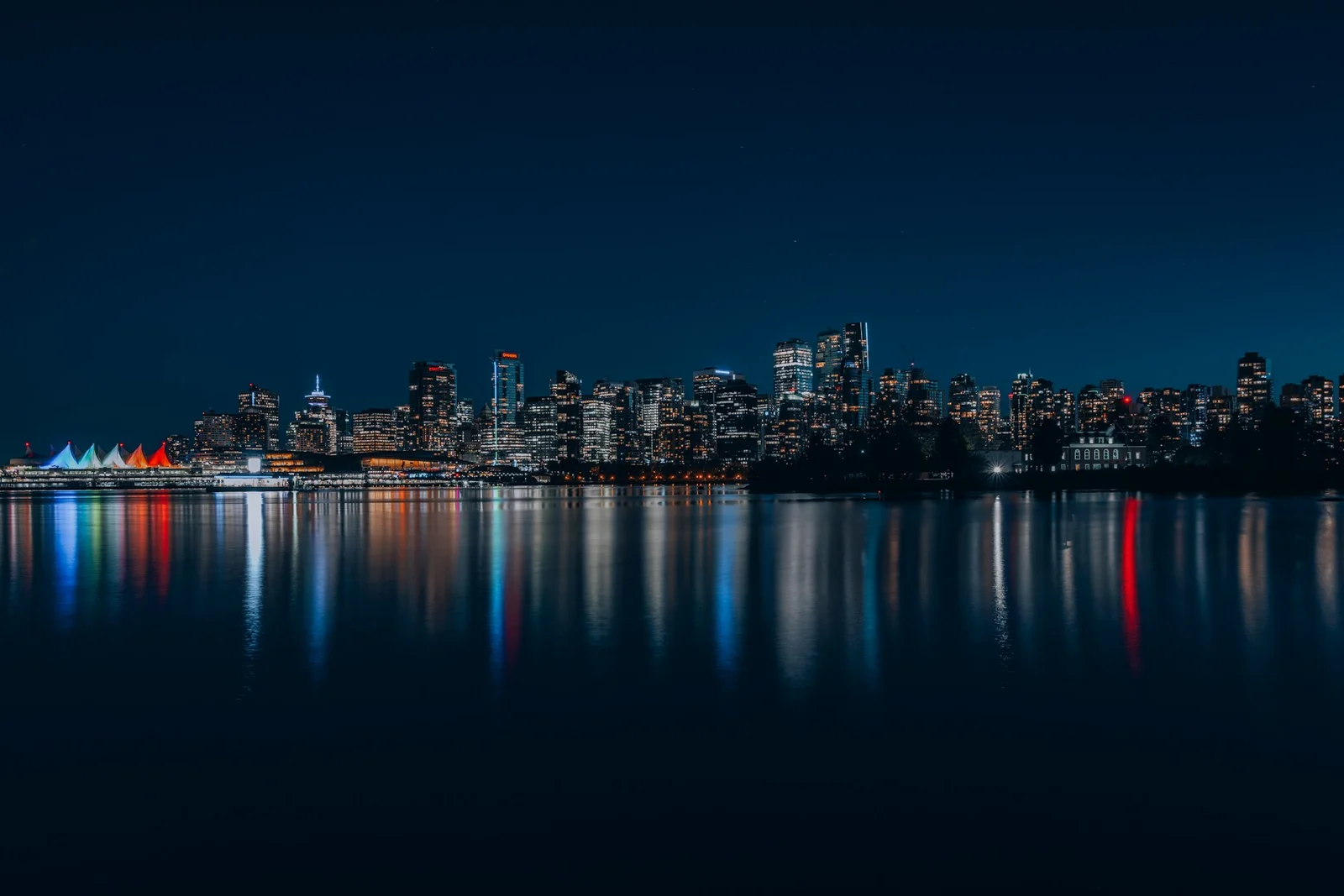 Vancouver skyline reflected in the water at night